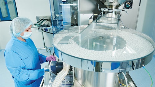 Pharmaceutical industry worker in a manufacturing facility